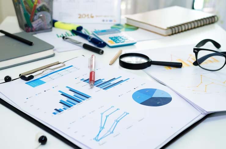 financial analysts working with business graphs and diagrams