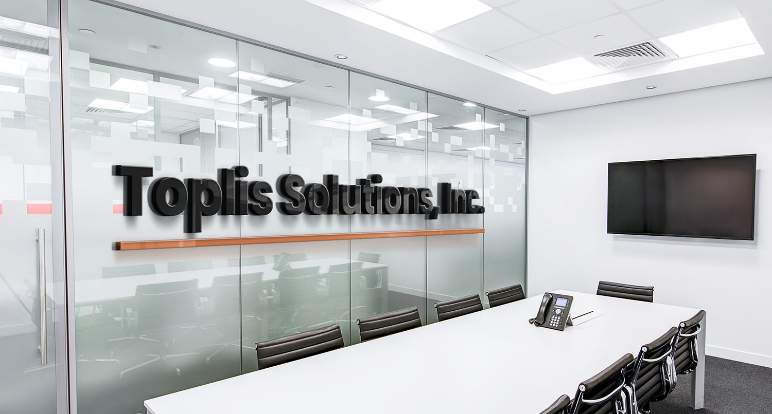 3D logo of Toplis Solutions in a room