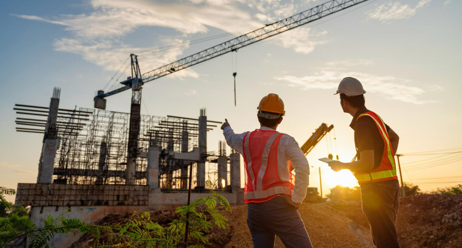 Contractors watching and pointing at the construction progress