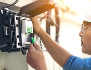 electrician making changes to the electrical circuit